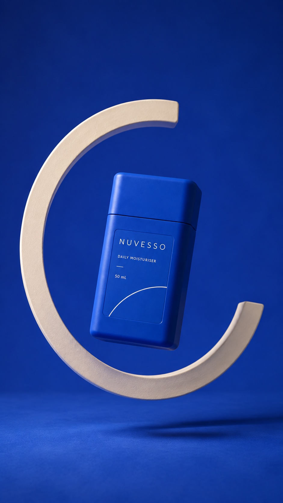 Cobalt NUVESSO bottle suspended inside an ivory open hoop